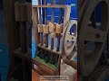 Wooden Pounding Mechanism Turning Wheel Into Rhythm
