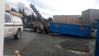 Bin truck picking up bin