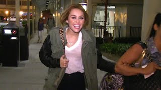 Miley Cyrus Goofs With Photographers At Burbank Airport After BMAs [2012]