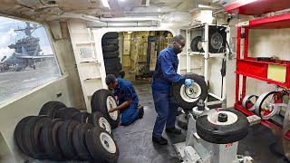 Inside Tiny Shop on US Aircraft Carrier Repairing Fighter Jet Tires at Sea