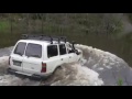 20 year old Landcruiser crossing a river with water over roof!