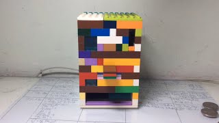 Rubber band powered lego candy machine