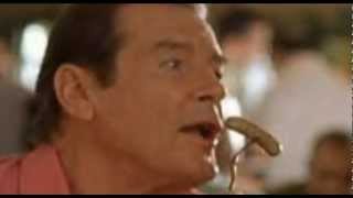 Roger Moore 'fellating' a sausage