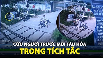 Thót tim nữ nhân viên gác chắn cản người ngay trước mũi tàu hỏa