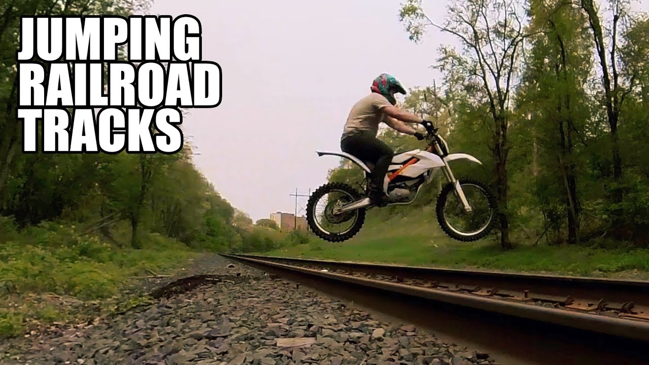 Jumping the railroad tracks with the KTM Electric Dirt bike YouTube