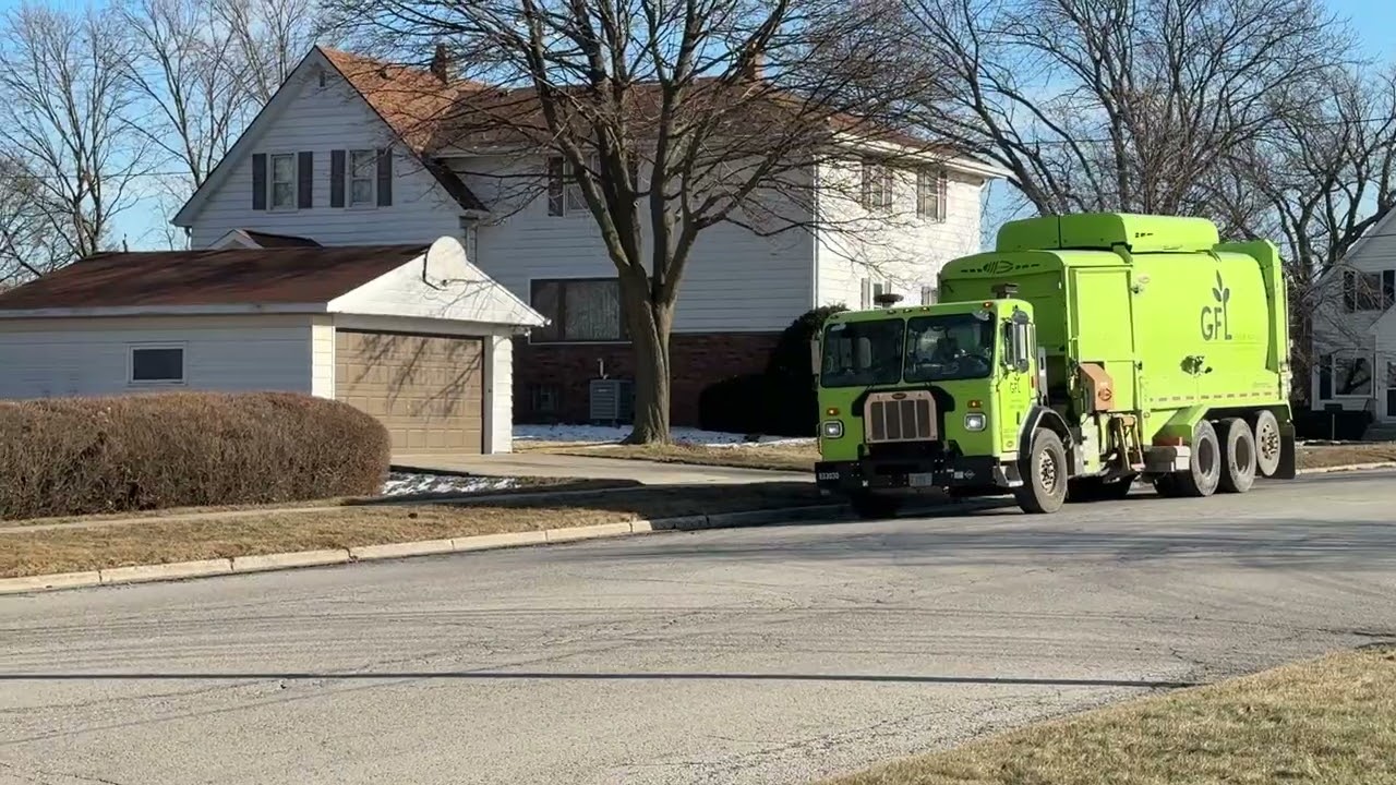GFL Environmental’s CNG Peterbuilt 520 Labrie Expert packing street recycling.