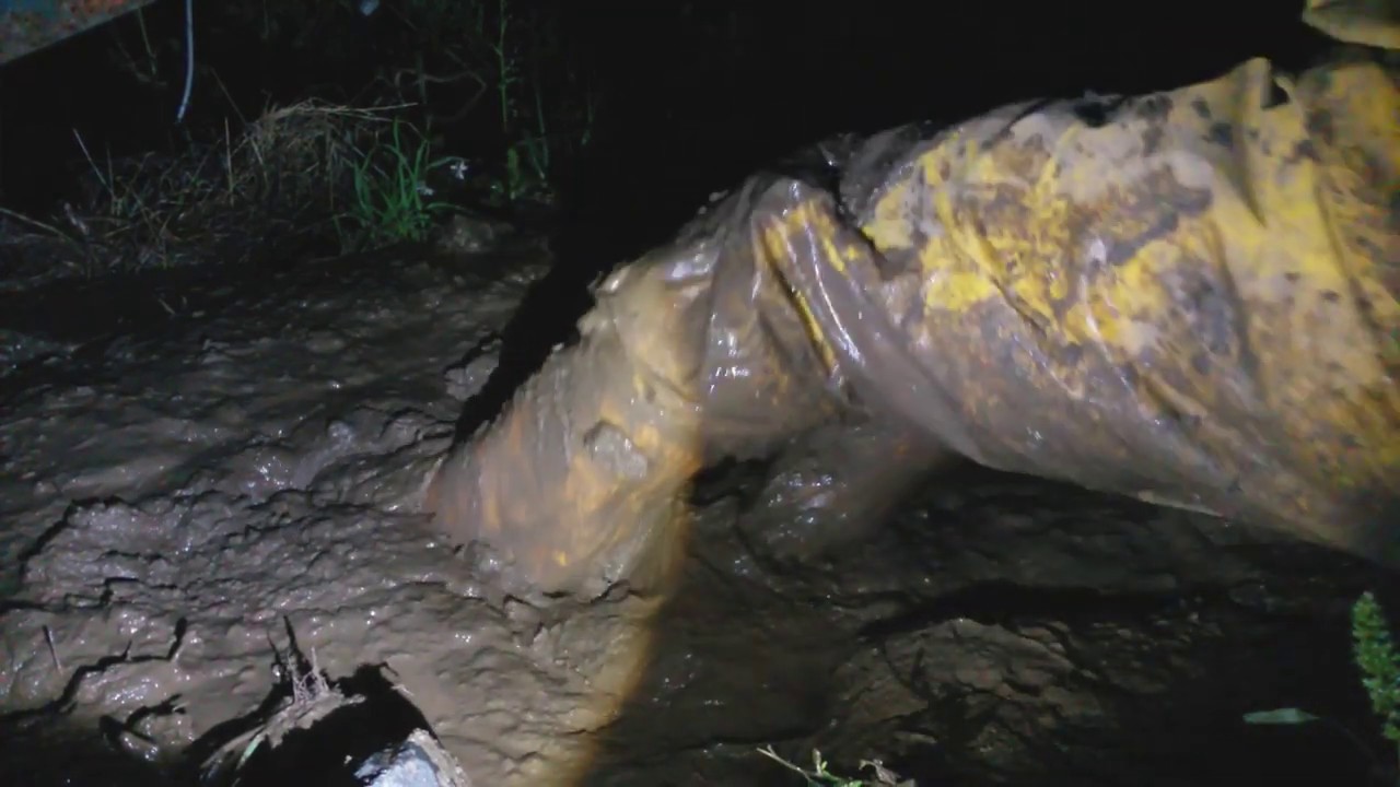 191010205 yellow hunters and rainwear muddy puddle at night