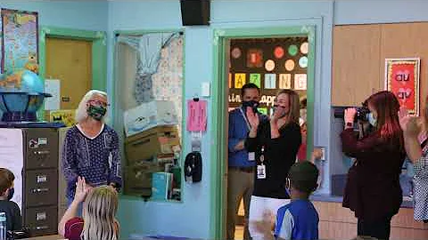 First graders surprise teacher Peggy Horne, reveal...