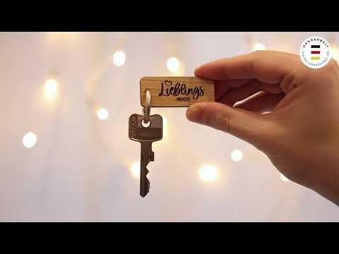 Schlüsselanhänger personalsiert mit Logo und Motive als Gravur