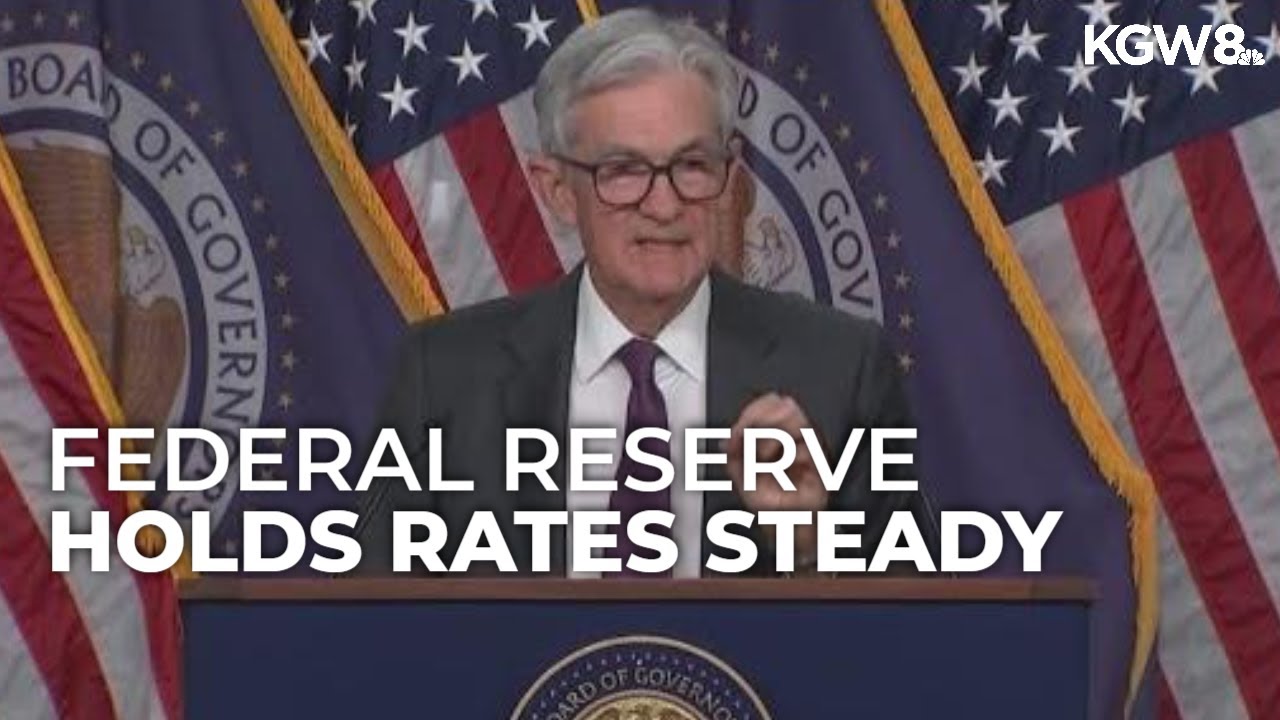 Federal Reserve holds rates steady, signals cuts ahead - YouTube