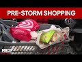 Shoppers pack grocery stores for necessities before snowstorm