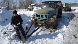 Towing an old truck on a farm (GoPro)