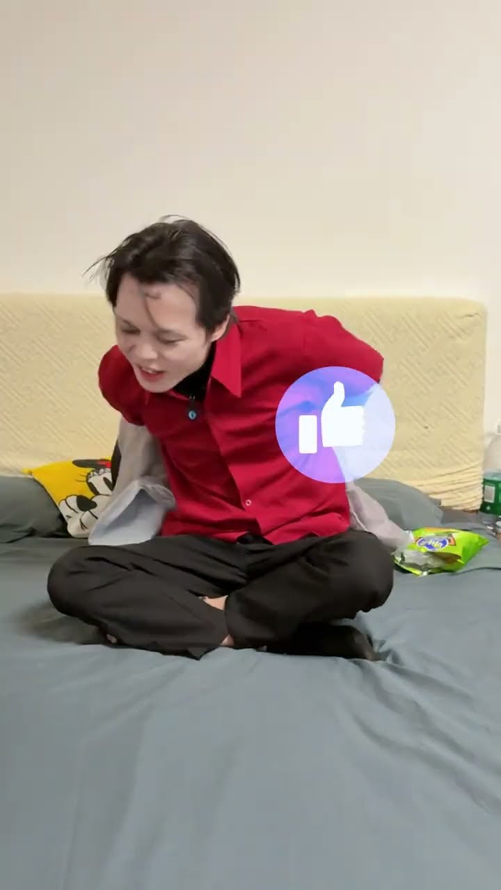 Unhygienic clown eating potato chips in bed