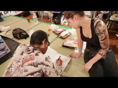 Horiyoshi III draw Japanese dragon at King of Tattoo convention in Tokyo