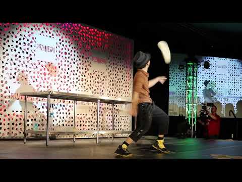 Master pizza makers compete in the Dough Tossing championships at the Pizza Expo in Las Vegas