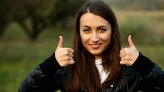 woman with thumbs up in nature portrait