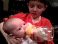 Brother's first time feeding baby sister
