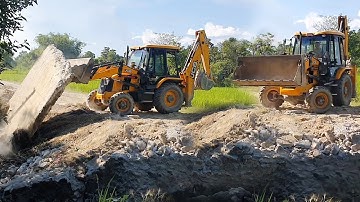 JCB 3DX ECO Backhoe Loader Throwing Out Heavy Concrete Slab From Road - JCB Earth Movers Working