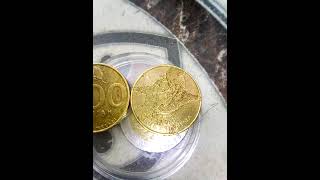 antique five hundred rupiah coins with jasmine flowers