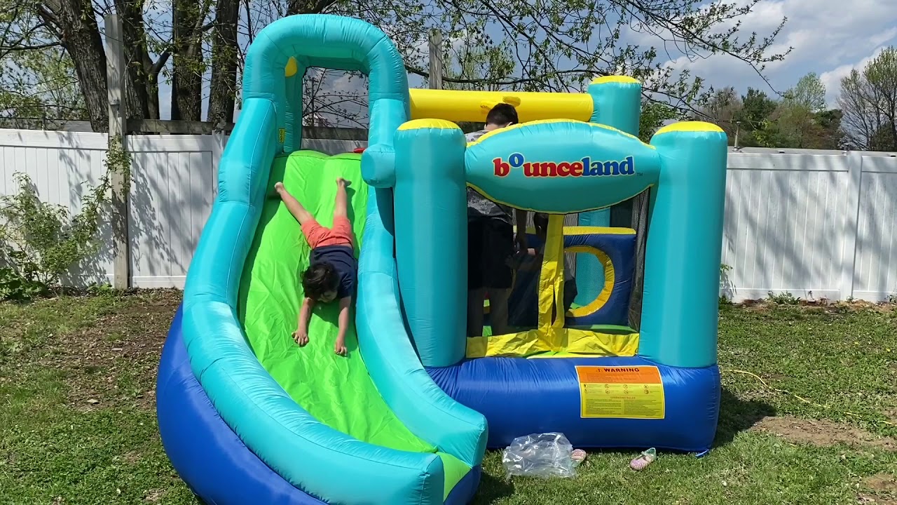 Amani & Adam In Inflatable Bounce House 