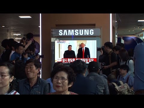 South Koreans applaud Trump-Kim handshake