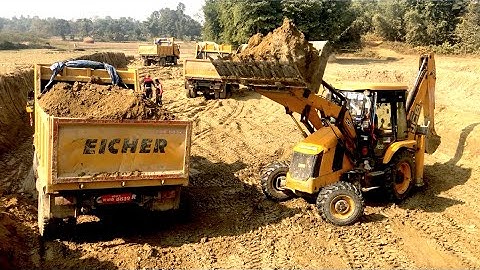 Loading Soil In Tripper Dum - JCB Backhoe 4x4 Machine Cutting Soil In Village Area