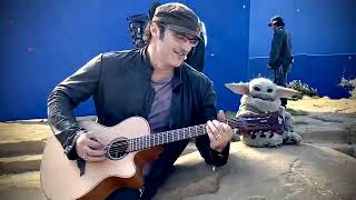 Robert Rodriguez and Baby Yoda (Grogu) jammin’ behind the scenes of TheMandalorian Chapter 14