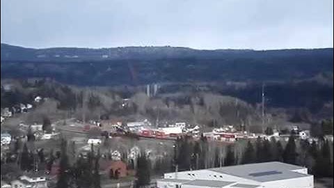 C.P.R. TRAIN CRUISING THROUGH NIPIGON NEW BRIDGE IN BACKGROUND