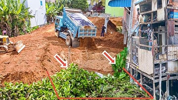 Start New Landfill Up To Build New By Skill Bulldozer Pushing Soil And   Truck 5 T Unloading Soil.