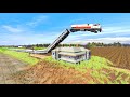 Four colorful trains crazy jumping over the house  crossing bumpy forked jumping railroad track