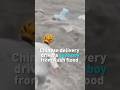 Chinese delivery drivers save boy from flood