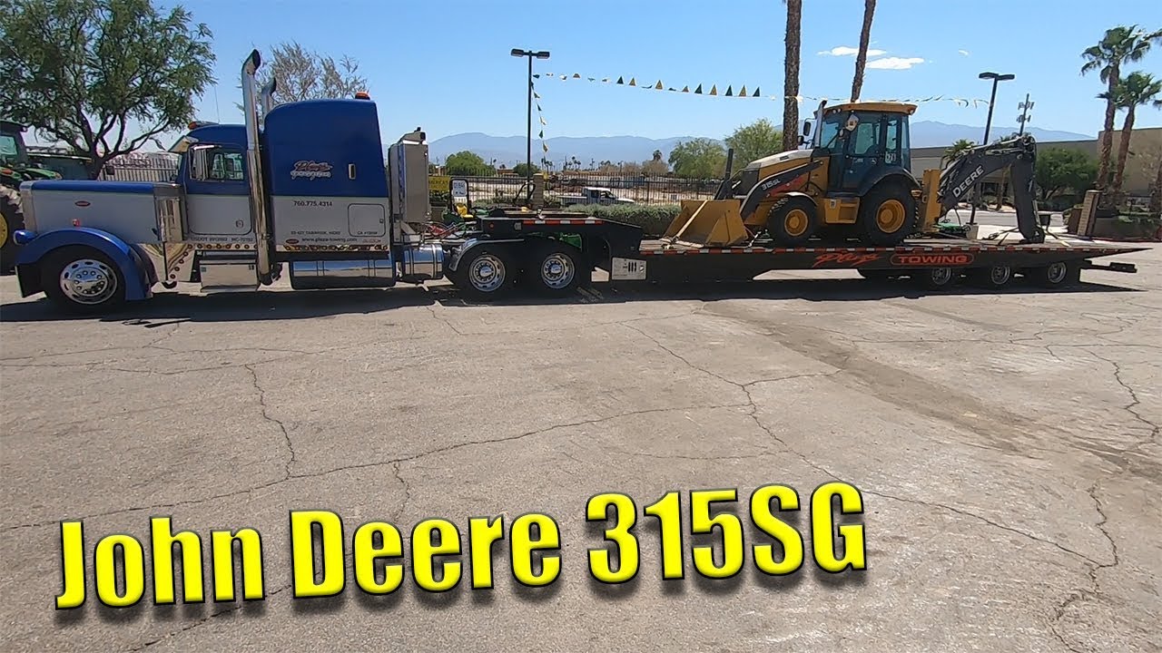 Transporting A John Deere 315SL - YouTube