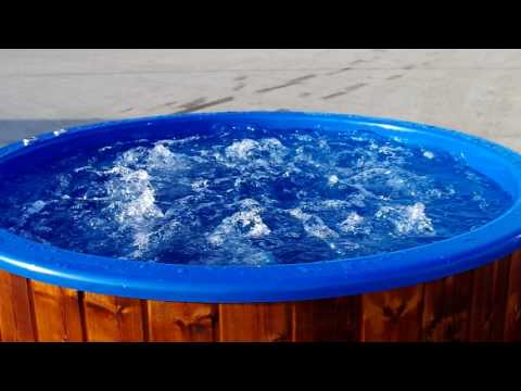 Round Fiberglass Hot Tub with a Wood-Fired Heater including Bubble system and LED lights.