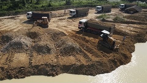 Amazing  Big Project Powerful 2 Bulldozer Pushing Soil with Dump Truck Unloading Soil into Water