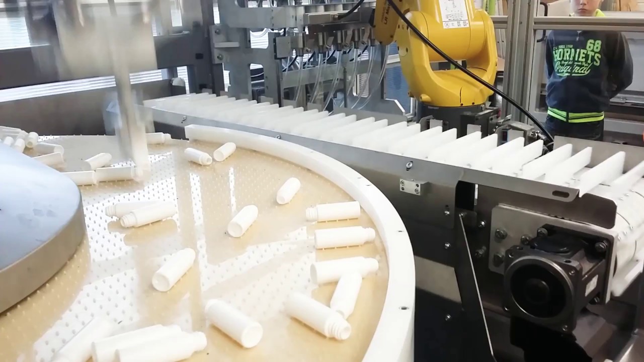 UNISTA - Bottle unscrambler with 2 robots