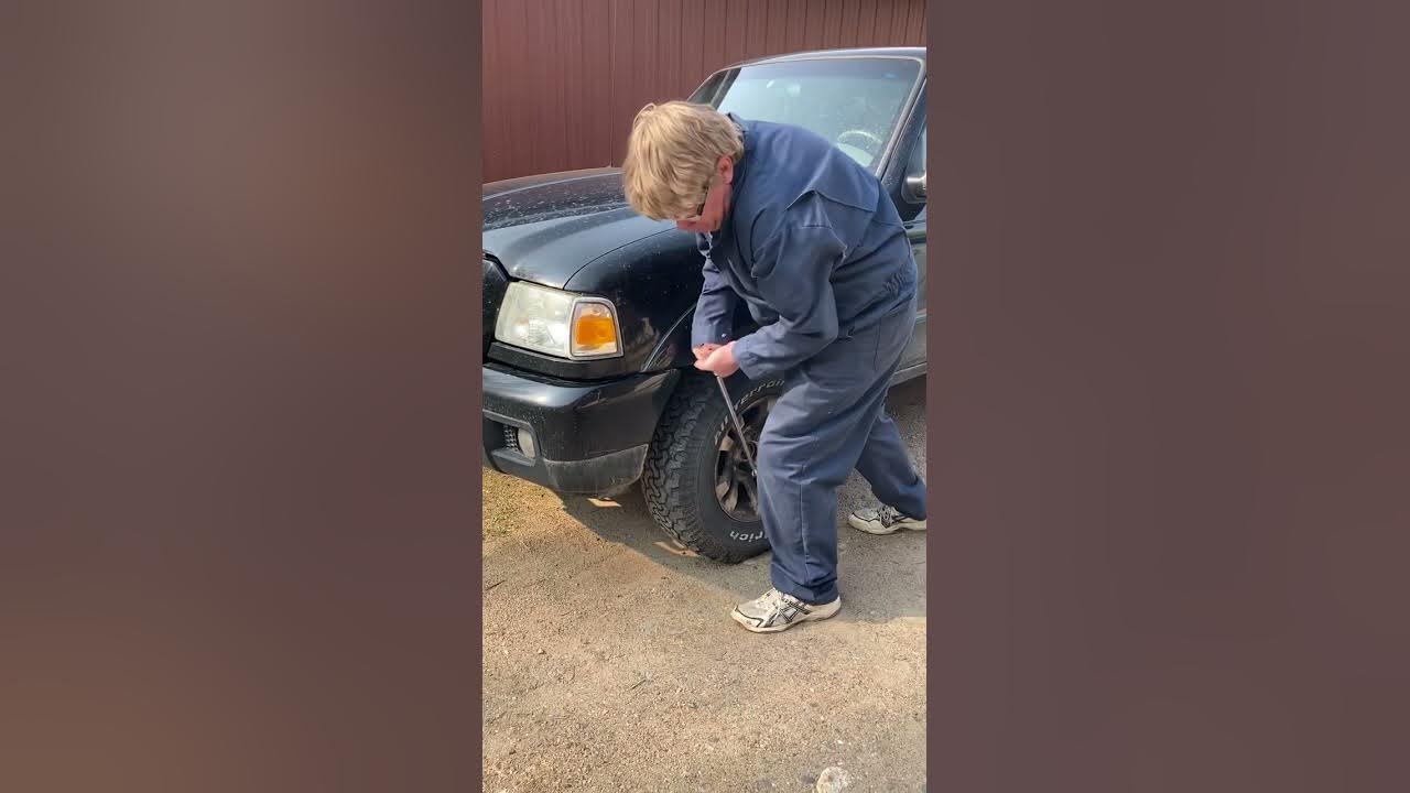 Arthur has to use brute force to get lug nuts off truck to fix the