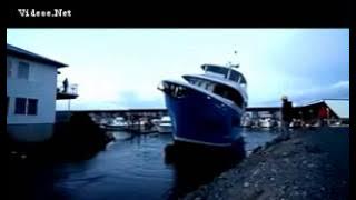Watch the moment brand-new $10MILLION yacht capsizes while being launched for new owner
