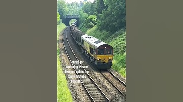 DB Cargo Class 66119 in EWS livery making its run from Round Oak to Margam at Kidderminster 12.06.23