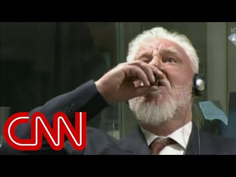 Video: War Criminal Drinks Alleged Poison