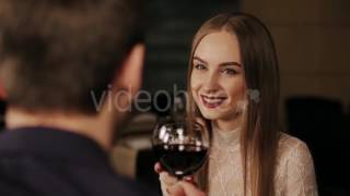 Young Happy Couple On Romantic Date Drinking Glass Of Red Wine - Stock Hive 15433863