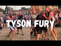 Tyson Fury pads workout on the beach with John Fury last summer while crowds of people watch