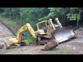 Steep slippery slope for a dozer and excavator