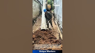 Installing poles with a machine: people installing poles with a machine