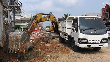 Excavator CAT 320D Digging Top Loading Into Dump Truck Isuzu Elf Road Constructions