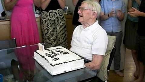 5.17.09 Herbert blows out his candles for his 100th birthday
