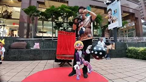 Balloon blowing clown puppet