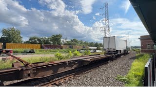 NS Bound Brook WB Stack train with local freight in background.