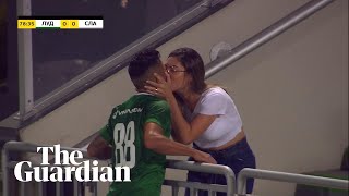 Footballer rushes to kiss wife in celebration … as goal is disallowed