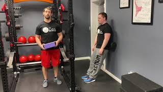 Wall Squat with a Foam Roller