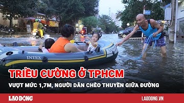 Triều cường ở TPHCM vượt mức 1,7m, người dân chèo thuyền giữa đường | Báo Lao Động